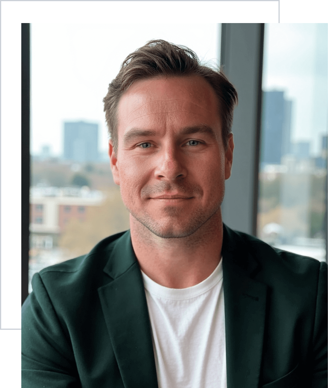 Smiling man in urban office setting