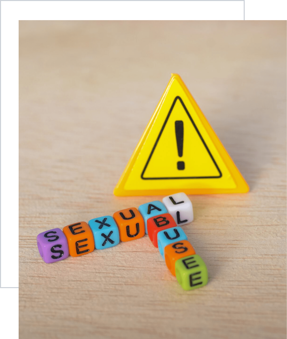 Warning sign with colorful letter blocks