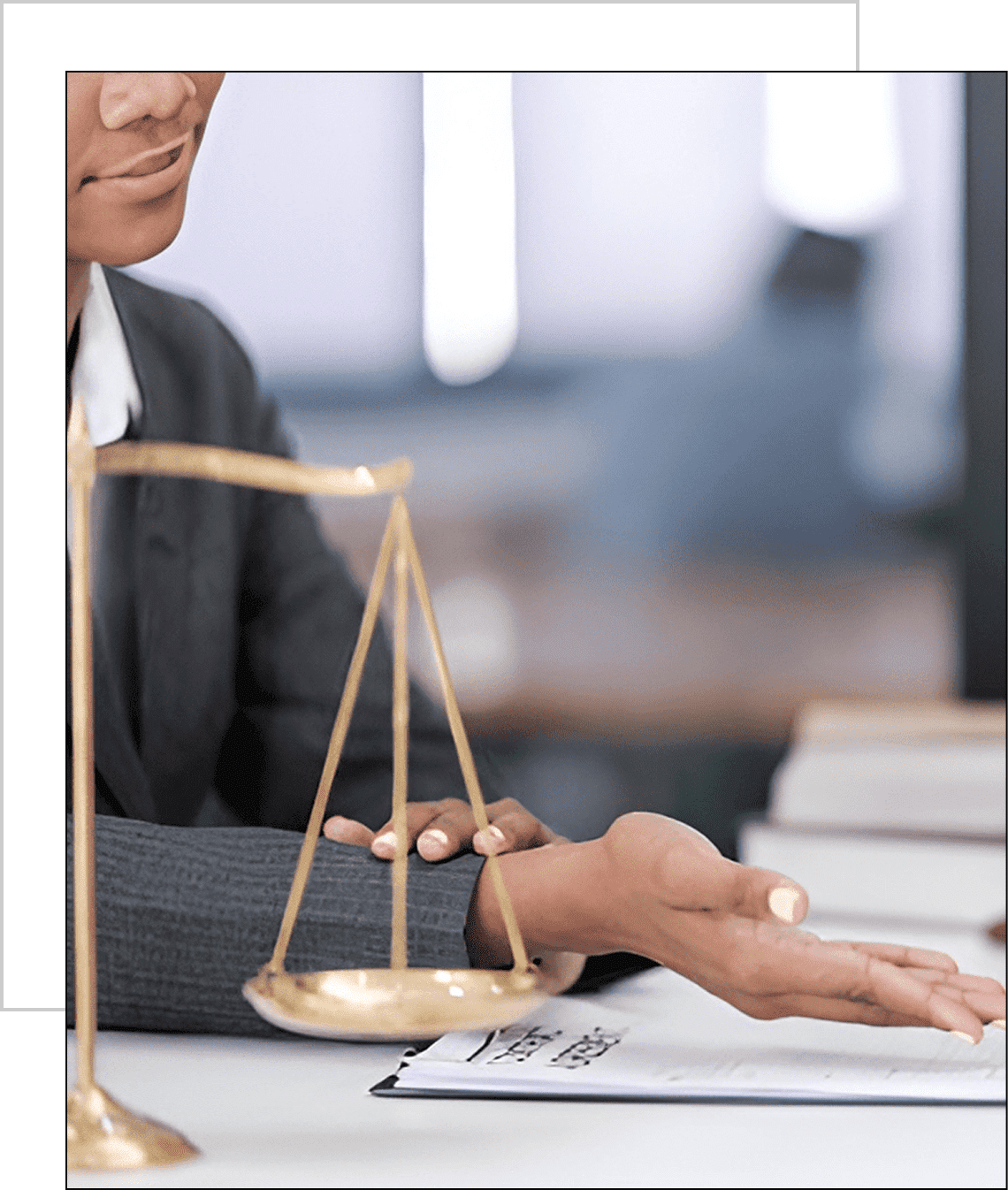 Lawyer gesturing near scales of justice